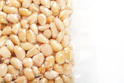 Pine nuts in a transparent vacuum package over Foto stock
