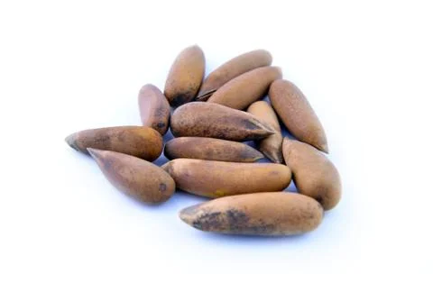 Pine nuts on white background isolated close up Stock Photos