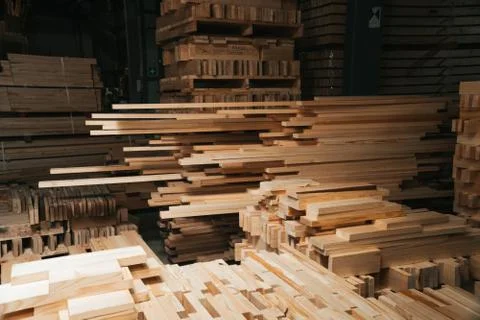 Pine sawn timber processed in a construction workshop. Concept of folded stacked Stock Photos