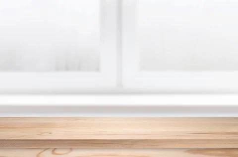 Pine table in a kitchen. Window with empty tabletop as template. Stock Photos