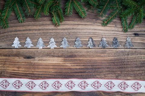 Pine tree with Christmas tree on old wooden background Stock Photos