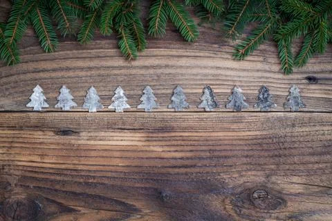 Pine tree with Christmas tree on old wooden background Stock Photos