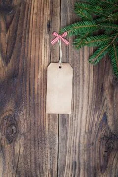 Pine tree with empty label on old wooden background Stock Photos