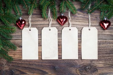 Pine tree with empty label on old wooden background Stock Photos