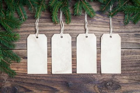 Pine tree with empty label on old wooden background Stock Photos