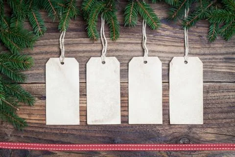 Pine tree with empty label on old wooden background Stock Photos