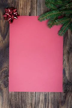 Pine tree with empty paper sheet on old wooden background Stock Photos