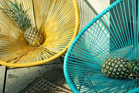 Pineapple. Ananas comosus. Two ananas with yellow and blue background. Stock Photos