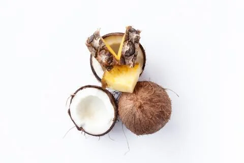 Pineapple and coconut on a white background Stock Photos