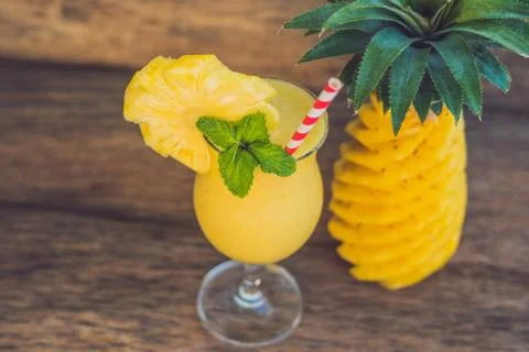 Pineapple and pineapple smoothies on an old wooden background Stock Photos