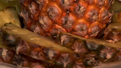 Pineapple and segments on plate, close-up Stock Footage 48124943