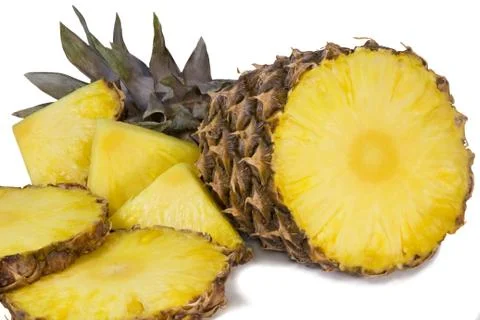 Pineapple and slices of pineapple on a white background. Stock Photos