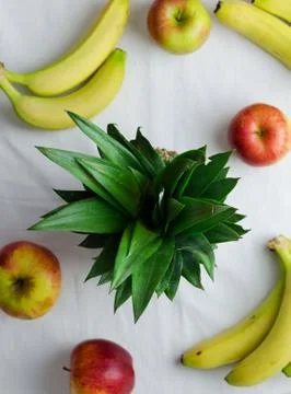 Pineapple, apples and bananas Stock Photos