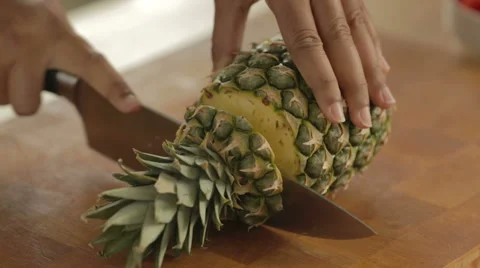 Pineapple being cut and sliced. Stock-Footage 42139938