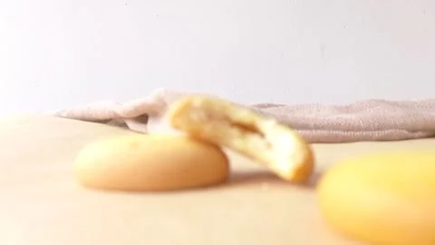 A pineapple biscuit on a wooden table Stock Footage 146249765