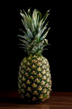 Pineapple on black isolated background Stock Photos