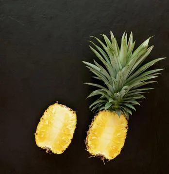Pineapple on the black texture background. .have a lot of fiber,vitamins C an Stock Photos