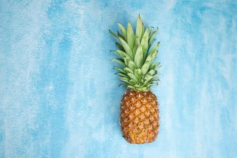 Pineapple on blue background with copy space Foto stock