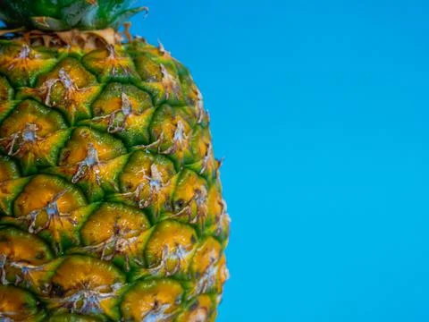 Pineapple on Blue Background Stock Photos