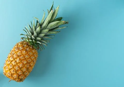 A pineapple is on a blue background Stock Photos