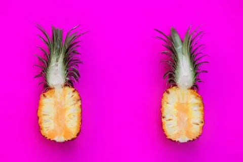 Pineapple on bright pink background Stock Photos