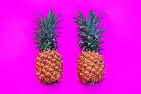 Pineapple on bright pink background Stock Photos