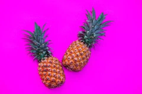 Pineapple on bright pink background Stock Photos