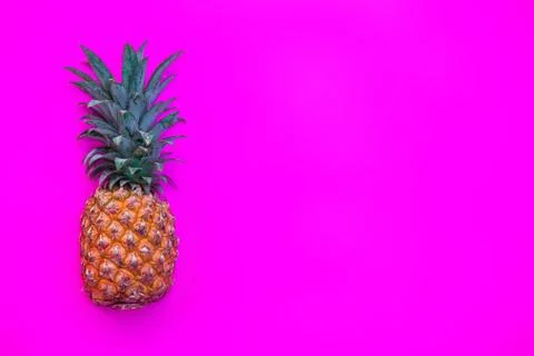 Pineapple on bright pink background Foto stock