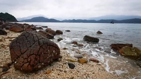 Pineapple bun stone at the seashore Stock Footage 232499848