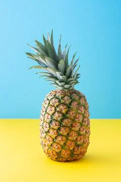 Pineapple close up on yellow blue background Stock Photos