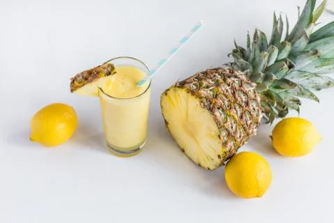 Pineapple cocktail with lemons and pineapple on white background Stock Photos