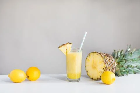 Pineapple cocktail with lemons and pineapple on white background Stock Photos