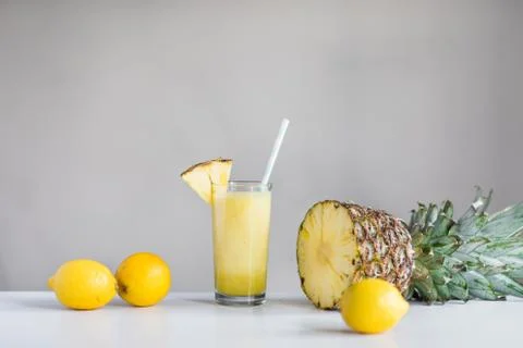 Pineapple cocktail with lemons and pineapple on white background Stock Photos