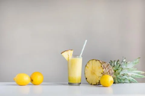 Pineapple cocktail with lemons and pineapple on white background Stock Photos
