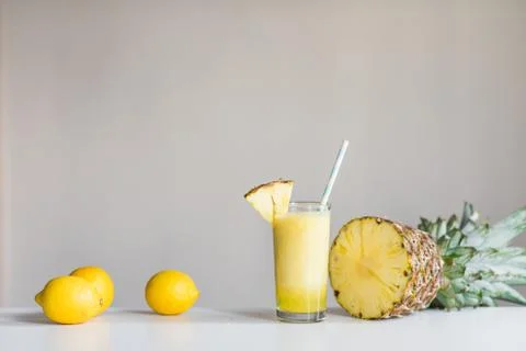 Pineapple cocktail with lemons and pineapple on white background Stock Photos