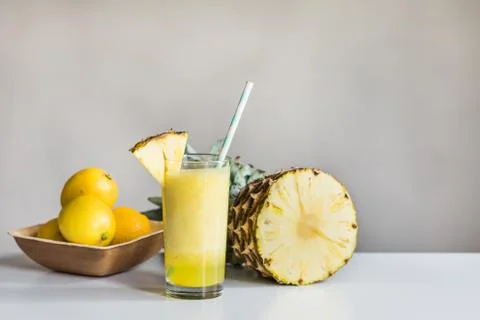 Pineapple cocktail, pineapple and lemons on white background Stock Photos