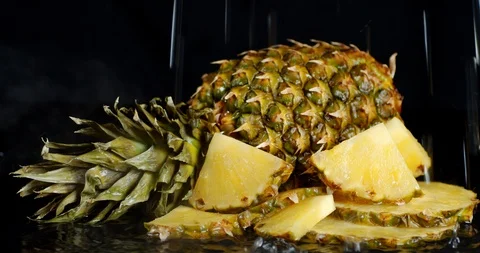 A pineapple with cool steam falling drops of water. Stock Footage 129802184