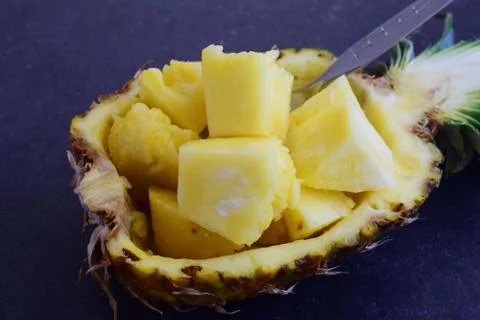 Pineapple cubes in its own pineapple bowl Stock Photos