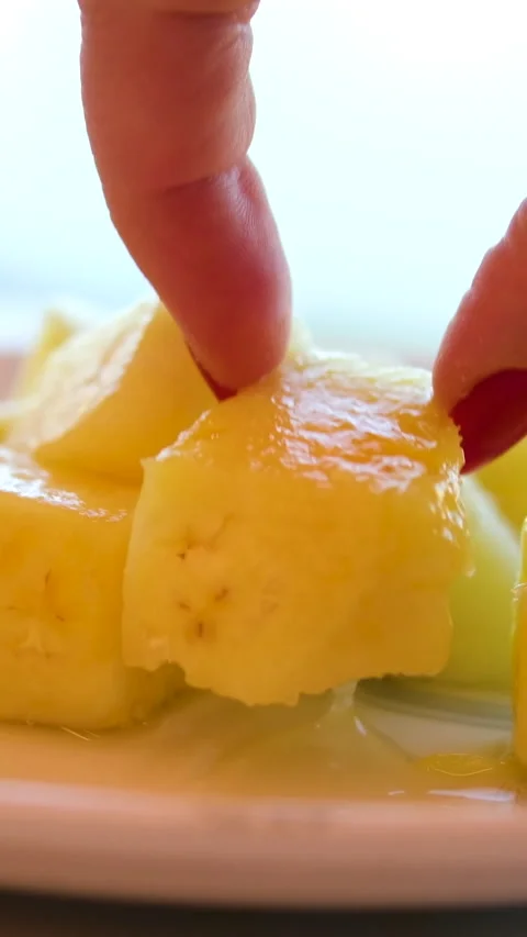 Pineapple cubes plate canned pineapple Slices, rotation in circle. pineapple Stock Footage 314525407