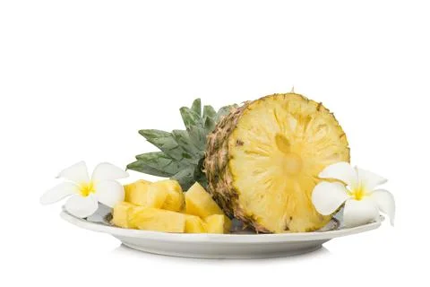 Pineapple on dish half with flower isolated on white background Stock Photos