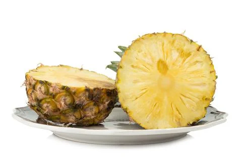 Pineapple on dish half isolated on white background Stock Photos