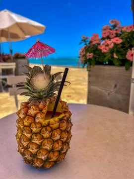 Pineapple Drink by the Beach Stock Photos