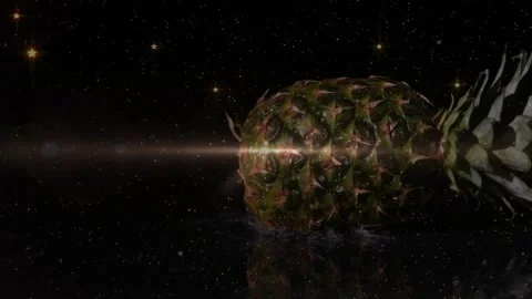 Pineapple entering void sparking lens flare, rotating, emitting falling sparkles Video stock 318936796