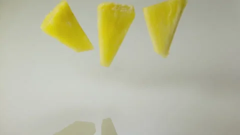 Pineapple falling in milk and splashing Stock Footage 149434135