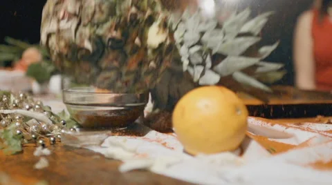 A pineapple falling on a table in slow motion Stock Footage 61081642