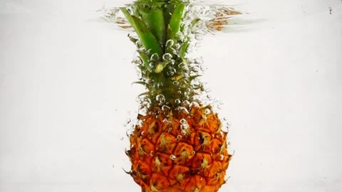 The pineapple falls into the water with a lot of bubbles. Fruits on isolated 스톡 동영상 151862659