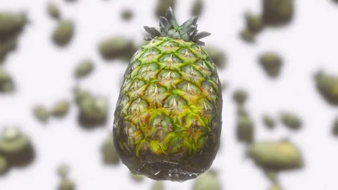 Pineapple Floating Against an Out of Focus White Background 库存影片 72299674