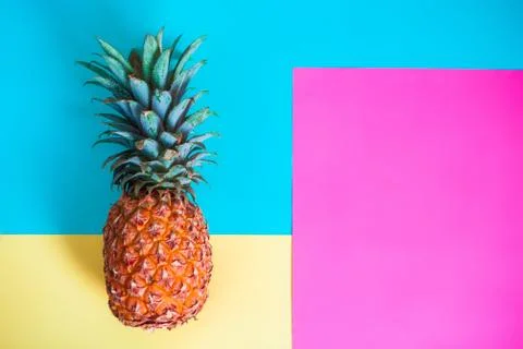 Pineapple fruit on bright colored backgrounds Stock Photos