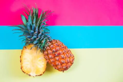 Pineapple fruit on bright colored backgrounds Stock Photos