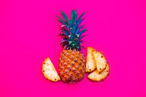 Pineapple fruit on bright colored backgrounds Stock Photos
